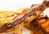 Апетитно! Мариновани свински ребра с гарнитура от печени картофи и свежа салата от Delano Bar and Dinner! - thumb 1