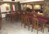 Порция паниран хек върху зелена салата и киноа в Ресторант-механа Мамбо в центъра на София! - thumb 2
