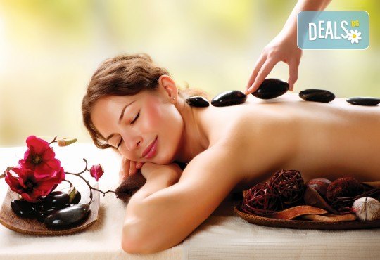 Релаксиращ масаж на гръб с топли вулканични камъни, Hot Stone терапия и етерични масла бадем или лайка в Спа център Senses Massage & Recreation! - Снимка 1